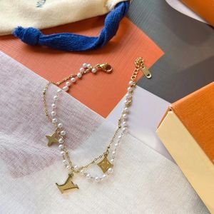 Bracelets de bijoux de créateurs Bracelet à breloques avec quincaillerie en or pour femmes dragonne motif de fleur marron logo timbre imprimé cadeau de mode