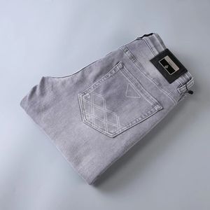 diseñador para hombre Jeans Elasticidad Jean Hombre pantalones hombres y mujeres marca de moda pantalones de lujo pantalón de mezclilla Trend Brand Pantalones de motocicleta Mens Skinny LOGO botones