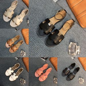 Designer Sandals One Strap Chaussures pour femmes Voyage Sandales plates Plage Chaussures romaines Rooted Open Toe Sandals Mules avec la taille de la boîte 35-42