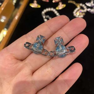 Diseñador Vivienen Westwoods New Viviane Empress Dowager Saturn Pins Pendientes esmaltados para mujer Pendientes ligeros de lujo azul dulce naranja Planeta Edición alta