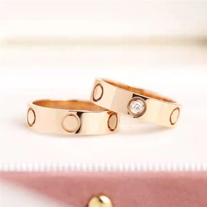 diseñador para mujer anillo de oro anillos de lujo para mujer para hombre Regalo de aniversario Banda de compromiso de boda de acero de titanio con diamante 18K chapado en oro rosa plata
