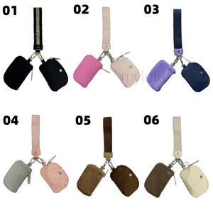Yoga bracelet pochette porte-clés portefeuille sac de yoga sac de sport mini sac à main design avec fermeture éclair amovible enveloppant autour du protège-poignet portefeuille portable sac à monnaie sac de poche rose