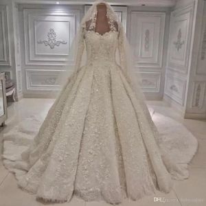 Luxurious Dubai-Inspired Beaded Lace Ball Gown with Long Sleeves and Cathedral Train, Ivory Bridal Dress with Veil