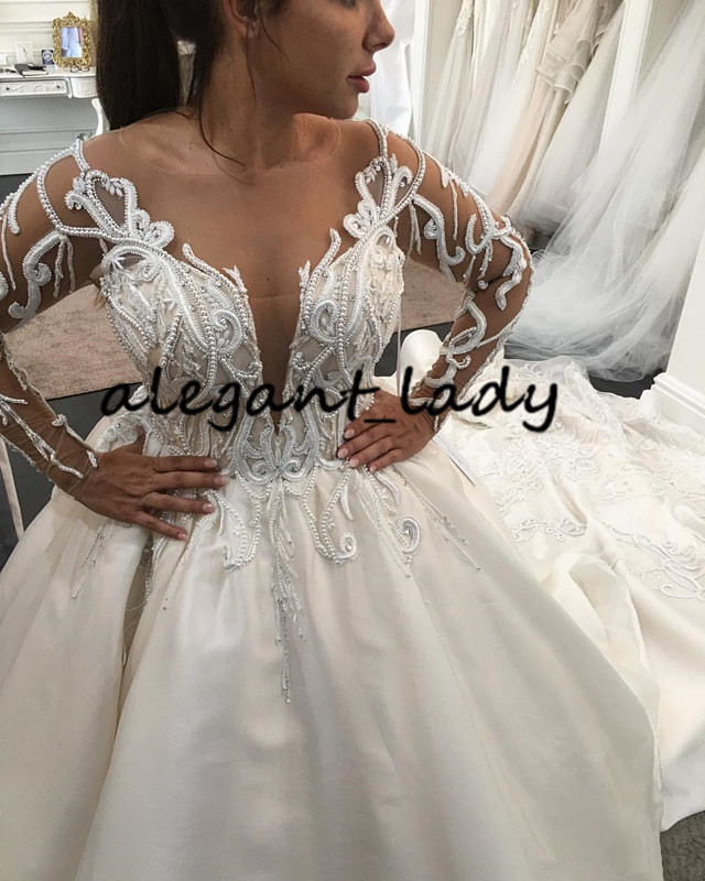Luxury Pearls Long Sleeve Wedding Dresses 2020 Plus Size Lace Applique Cathedral Train Princess Arab Dubai Castle Wedding Gown