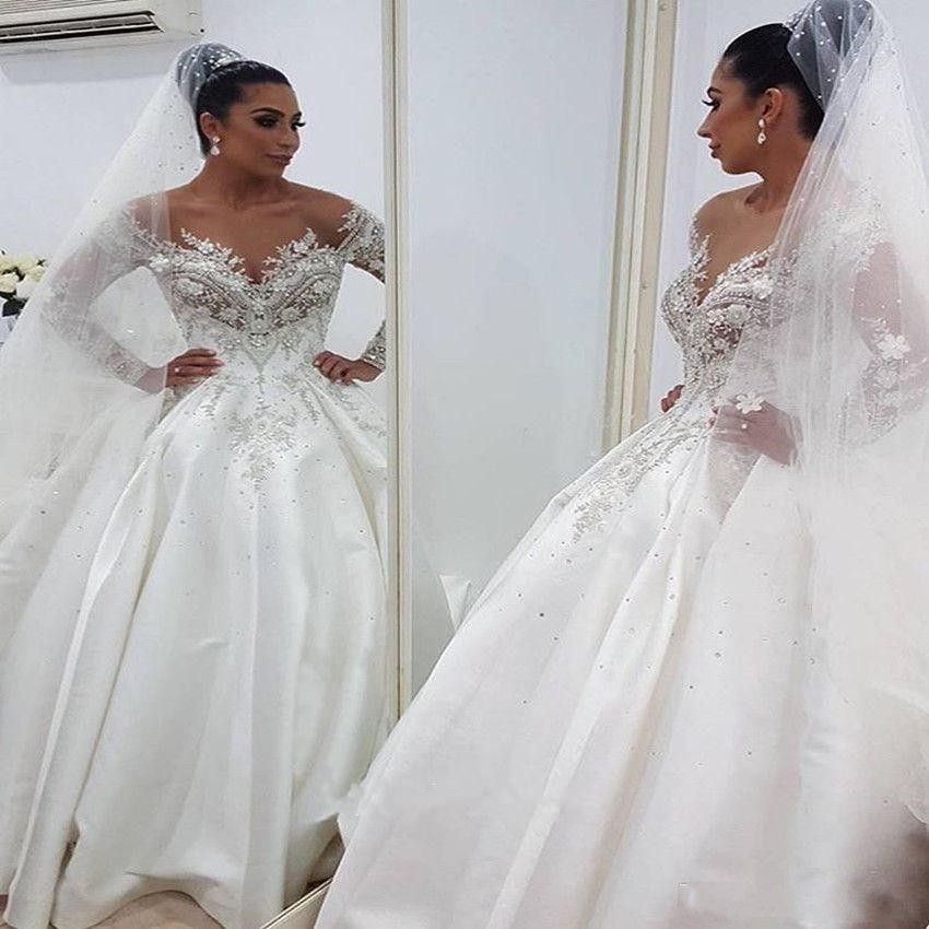 New Ball Gown Wedding Dresses Sheer Neck Long Sleeves Illusion Crystal Beaded Satin Sexy Back Chapel Train Plus Size Bridal Gowns