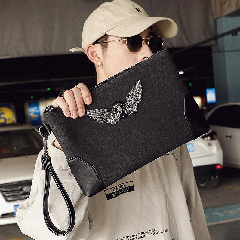 wholesale men handbag street trend metal ghost head men wrist bag personality skull mens hand clutch multifunctional contrast leather envelop, Black(boutique box) 
wholesale men handbag street trend metal ghost head men wrist bag personality skull mens hand clutch multifunctional contrast leather envelop, Black(boutique box)