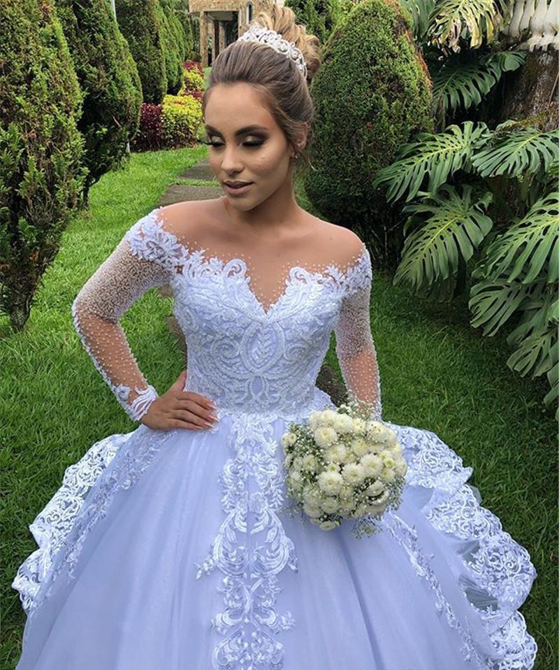 2020 New Hot Sexy Arabic Long Sleeves A Line Wedding Dresses Illusion Lace Appliques Beaded Plus Size Court Train Sheer Back Bridal Gowns