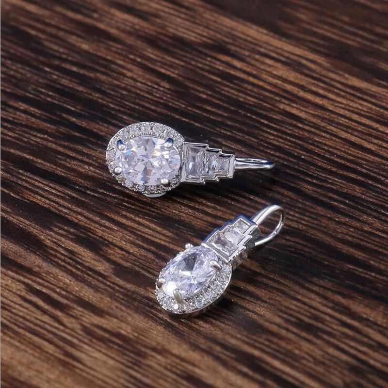 Top-Selg Vintage Jewelry: Oval Cut White Topaz Dangg Earrings in Sterg Sier for Women