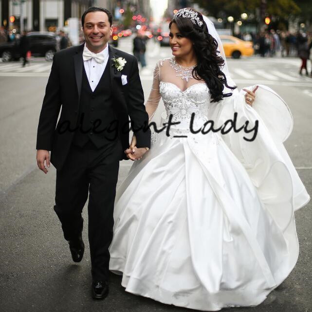 Illusion Long Sleeve Princess Wedding Dresses 2020 Sparkly Crystal Beaded Sheer Neck Puffy Skirt Church Bride Wedding Gowns