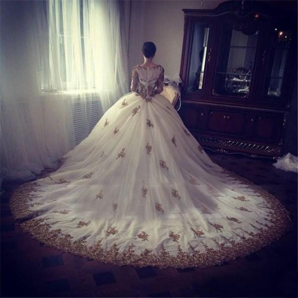 2019 Sparkly White and Gold Ball Gown Wedding Dresses Modest Jewel Neck Long Sleeves Beaded Lace Appliqued Custom Bridal Gowns