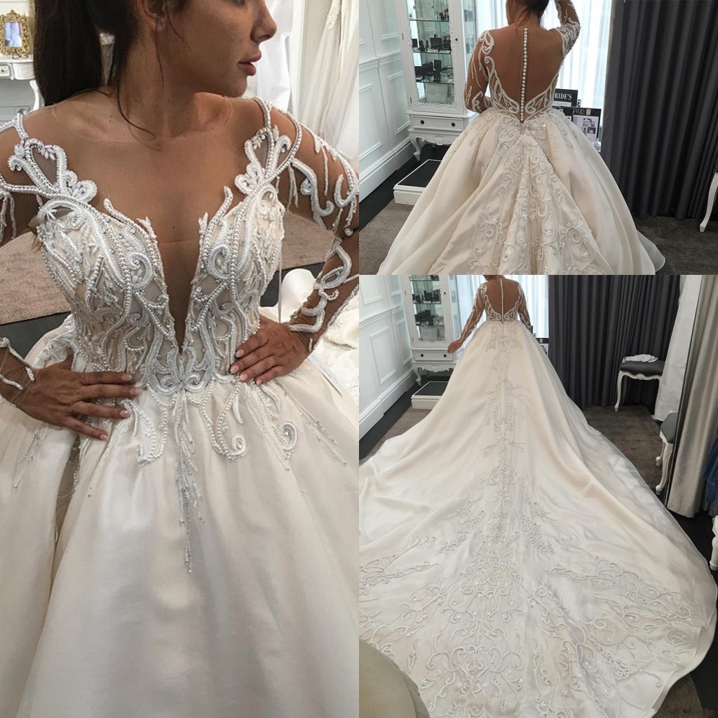 Luxury Pearls Long Sleeve Wedding Dresses 2020 Plus Size Lace Applique Cathedral Train Princess Arab Dubai Castle Wedding Gown
