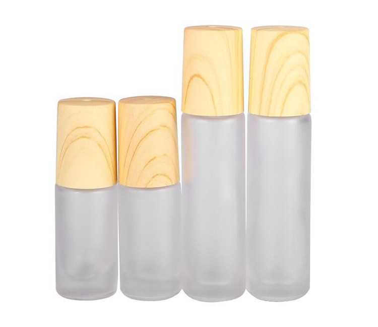 Frosted Clear Glass Roller Bottles Vials Containers with Metal Roller Ball and Wood Grain Plastic Cap for Essential Oil Perfume 5ml 10ml
Frosted Clear Glass Roller Bottles Vials Containers with Metal Roller Ball and Wood Grain Plastic Cap for Essential Oil Perfume 5ml 10ml