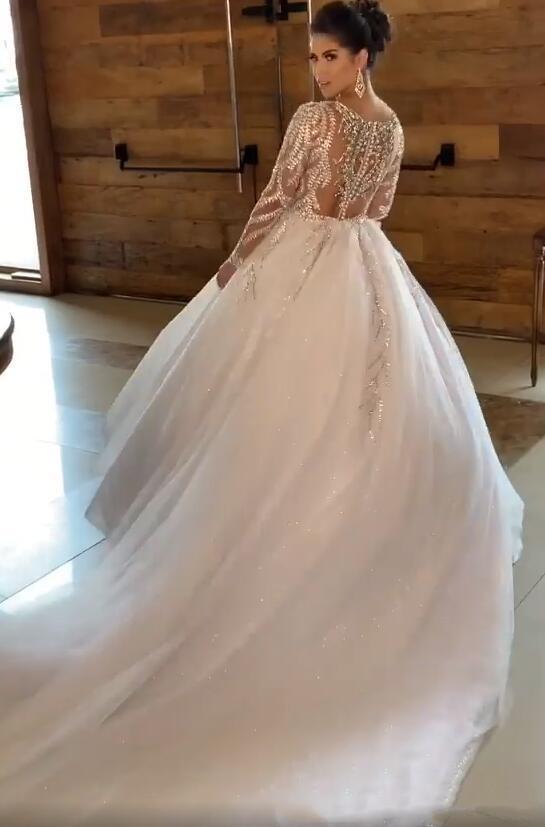 Sparkly Luxury Sheer O-neck Wedding Dresses with Illusion Long Sleeve 2020 Shiny Lace Pleats Beaded Arabic Church Wedding Gown