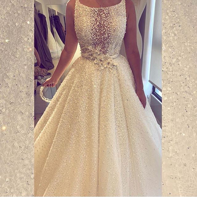 2020 Spaghetti A Line Bridal Gowns Backless Sweep Train Sequins Pearls Beading Rhinestone Wedding Dresses 3D Floral Appliques Abiti Da Sposa