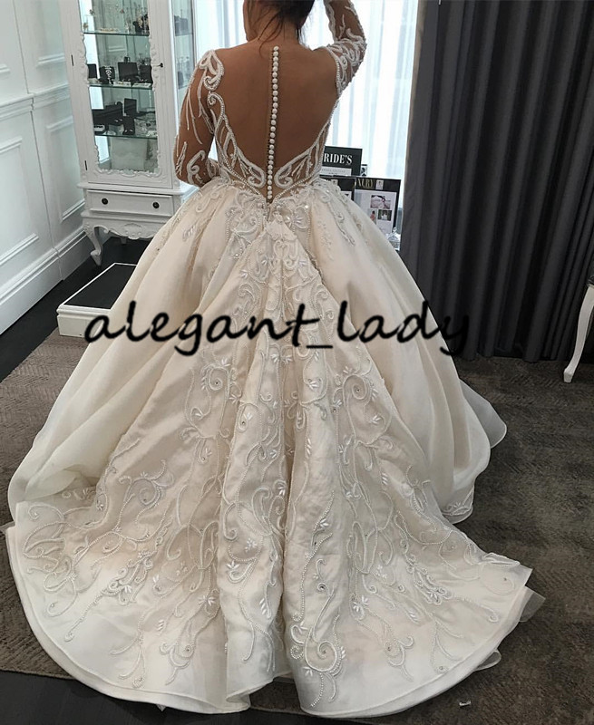 Luxury Pearls Long Sleeve Wedding Dresses 2020 Plus Size Lace Applique Cathedral Train Princess Arab Dubai Castle Wedding Gown