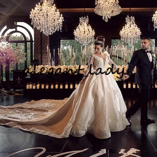 Luxury Pearls Long Sleeve Wedding Dresses 2020 Plus Size Lace Applique Cathedral Train Princess Arab Dubai Castle Wedding Gown