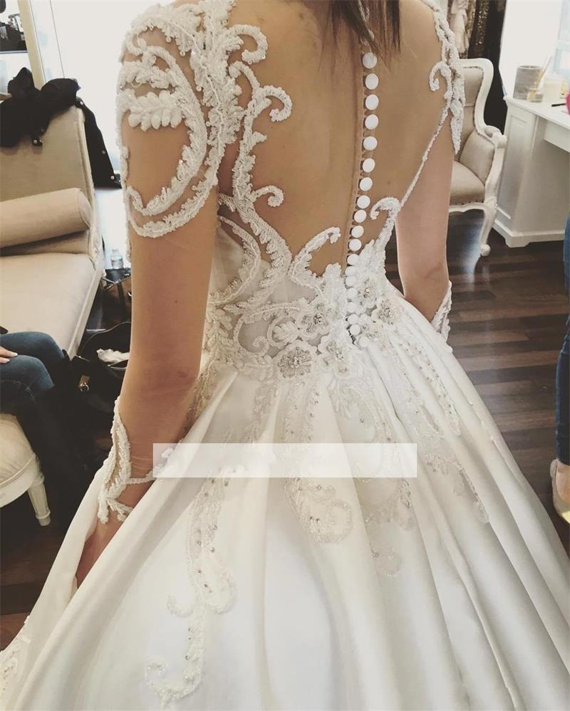 Vintage Illusion Long Sleeves Wedding Gowns Dress Lace Applique Beaded Sheer Neck Backless Ruffled Long Train Satin Bridal Gown