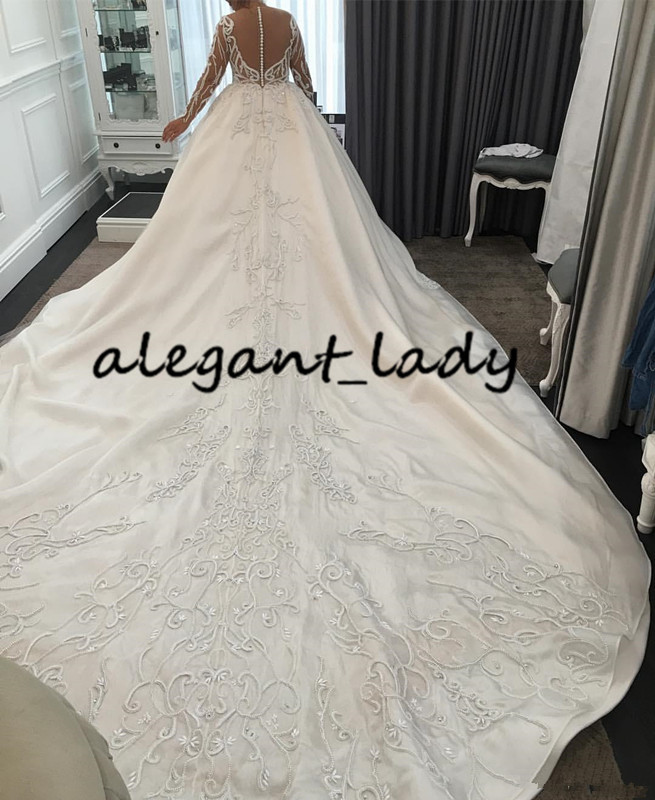 Luxury Pearls Long Sleeve Wedding Dresses 2020 Plus Size Lace Applique Cathedral Train Princess Arab Dubai Castle Wedding Gown