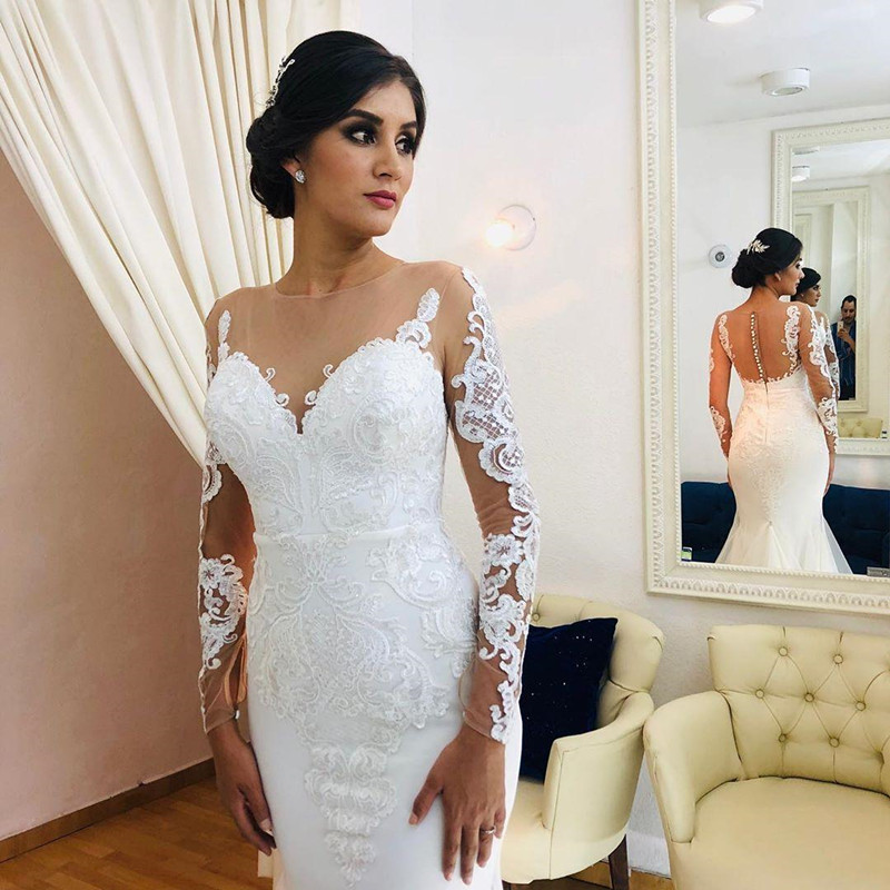 Illusion Long Sleeve Mermaid Wedding Dresses 2020 Sheer Jewel Neck Lace Applique Trumpet Sweep Train Aso Ebi Bride Wedding Gown