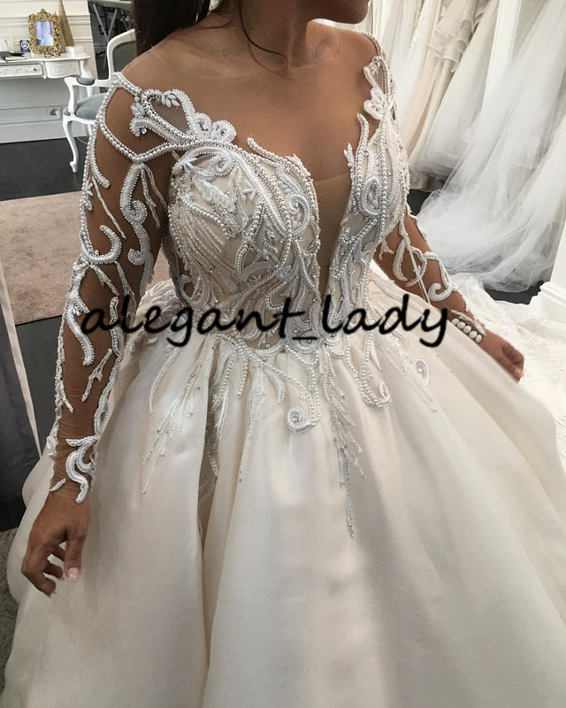 Luxury Pearls Long Sleeve Wedding Dresses 2020 Plus Size Lace Applique Cathedral Train Princess Arab Dubai Castle Wedding Gown