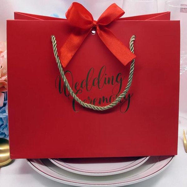 High-quality gifts Bow gift bag Portable paper bag Wedding supplies Tote bag wrapping paper bags with handle
High-quality gifts Bow gift bag Portable paper bag Wedding supplies Tote bag wrapping paper bags with handle