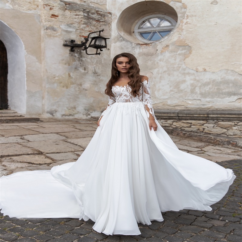 elegant long sleeves aline wedding dresses custom made lace tassel appliqued bridal gown hot sale bateau court train boho bridal gown