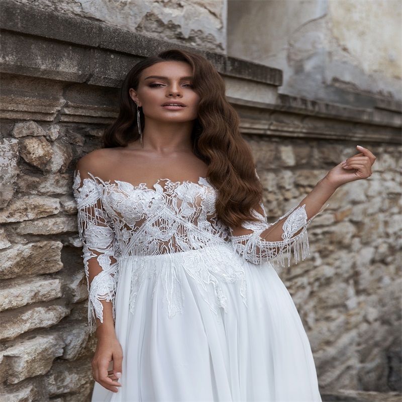elegant long sleeves aline wedding dresses custom made lace tassel appliqued bridal gown hot sale bateau court train boho bridal gown