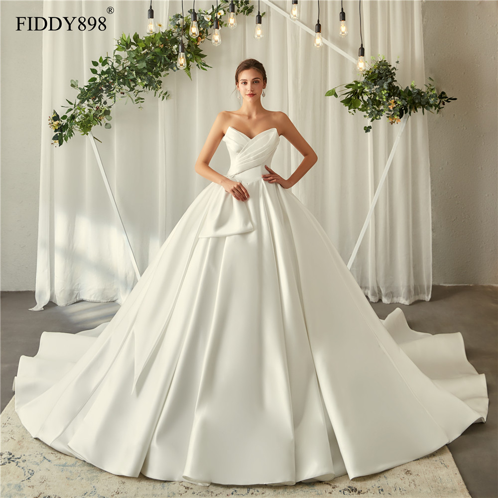 Royal Wedding Dresses 2020 V Neck Soft Satin Wedding Gown Puffy Ball Gown Ruffles Bridal Gown Long Train Vestido de Noiva, Ivory
Royal Wedding Dresses 2020 V Neck Soft Satin Wedding Gown Puffy Ball Gown Ruffles Bridal Gown Long Train Vestido de Noiva, Ivory