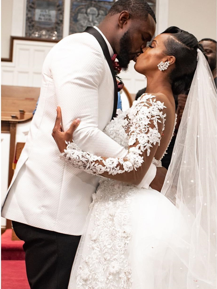 Charming African Floral Lace Appliquéd Ivory Wedding Dress for Bride with Beads & Long Sleeves  Ethereal Chapel Trail Veil