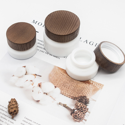 OEM oil lotion cream porcelain white 15g 50g cosmetic glass jars with dark bamboo lid 15g cosmetic skin care cream jar
OEM oil lotion cream porcelain white 15g 50g cosmetic glass jars with dark bamboo lid 15g cosmetic skin care cream jar