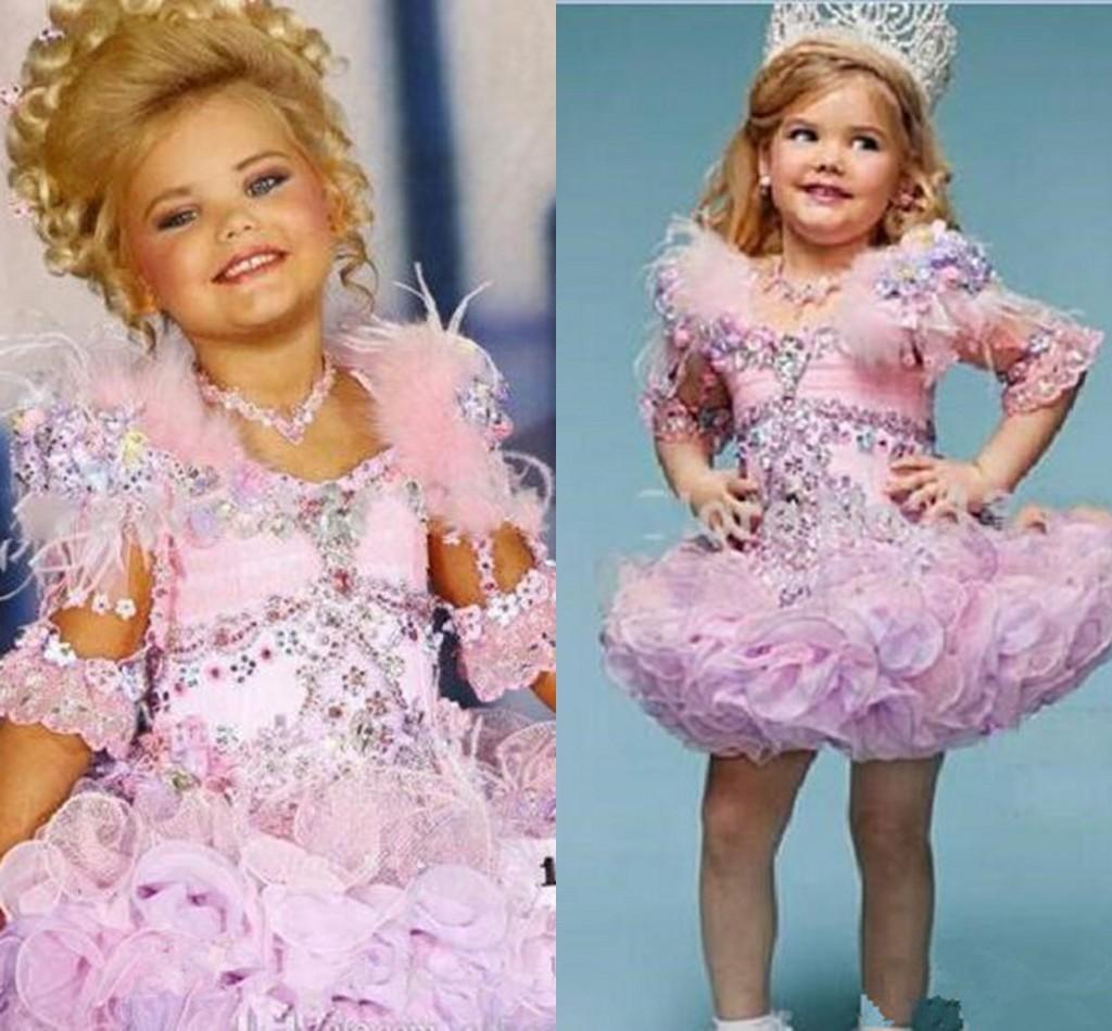 Lovely Eden Wood Pink Baby Toddler Pageant Dresses For Girls Glitz Rhinestones Ball Gown Pink Feathered Kids Party Dresses
