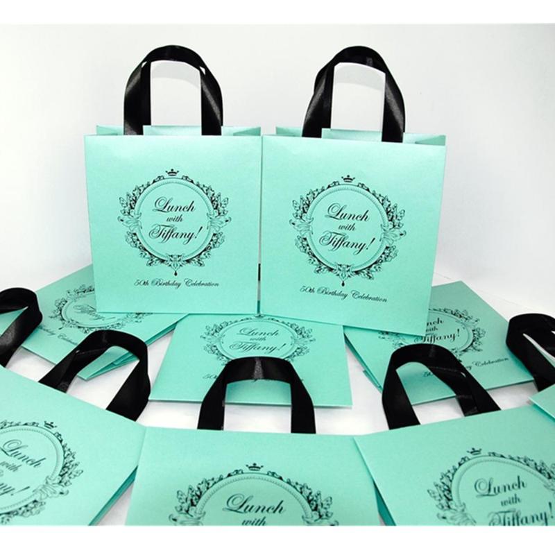 

Personalized Breakfast at Tiffany favor bags. Elegant 50th Birthday Bags for guests with satin ribbon & custom name. gift bags