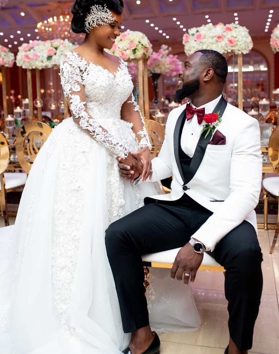 Charming African Floral Lace Appliquéd Ivory Wedding Dress for Bride with Beads & Long Sleeves  Ethereal Chapel Trail Veil