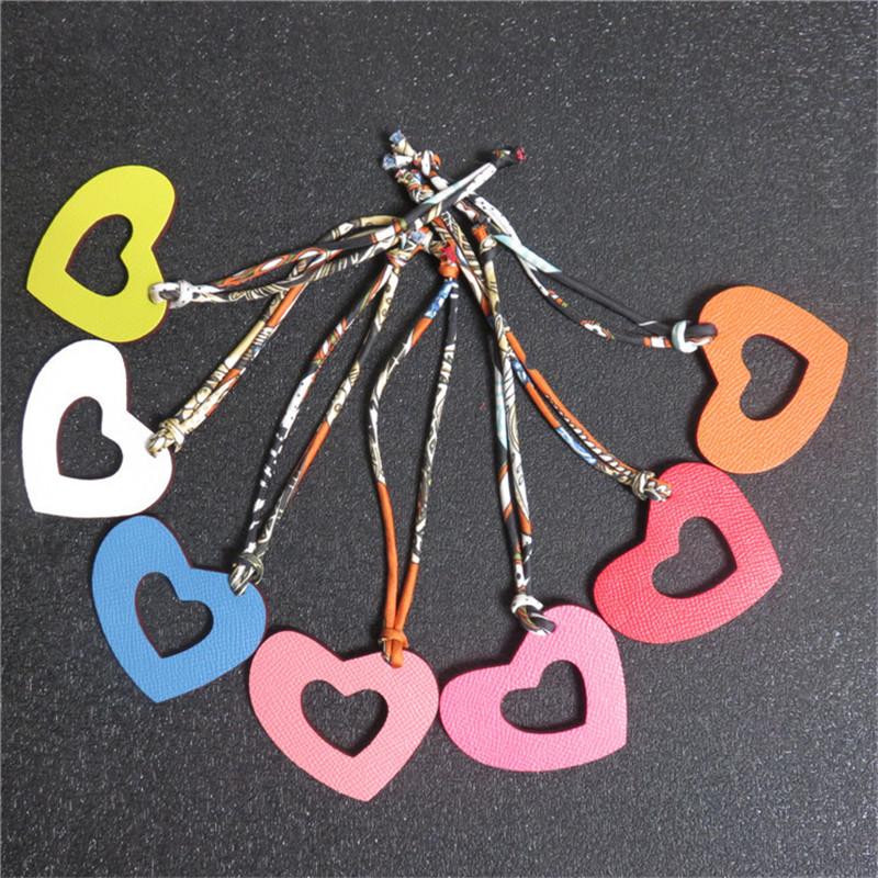 Handmade Hollow Out Genuine Leather Heart Keychain Women Real Silk String Luxury Two Color Leather Bag Charms Pendant Key Ring, Silver
Handmade Hollow Out Genuine Leather Heart Keychain Women Real Silk String Luxury Two Color Leather Bag Charms Pendant Key Ring, Silver
