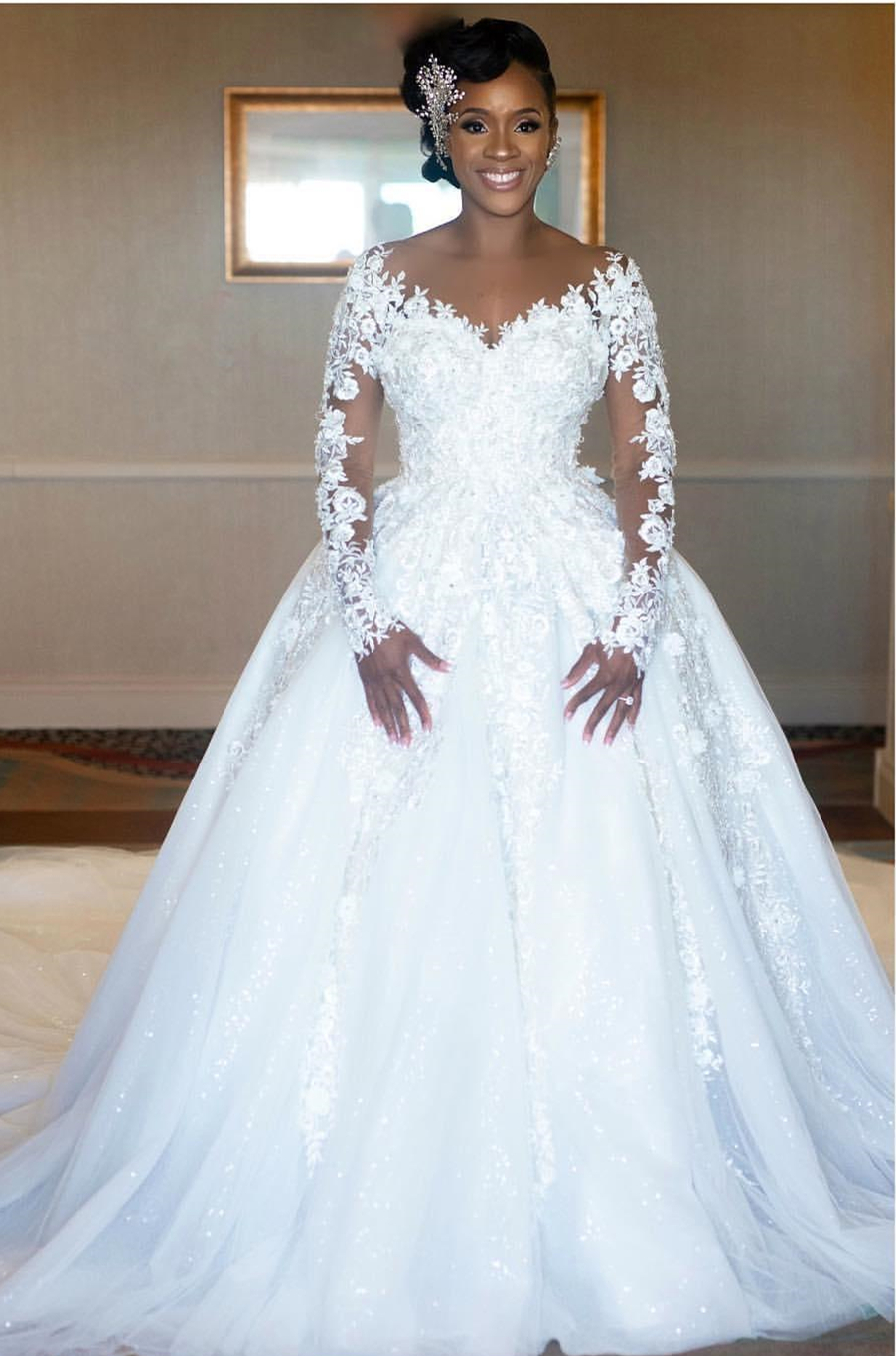 Charming African Floral Lace Appliquéd Ivory Wedding Dress for Bride with Beads & Long Sleeves  Ethereal Chapel Trail Veil