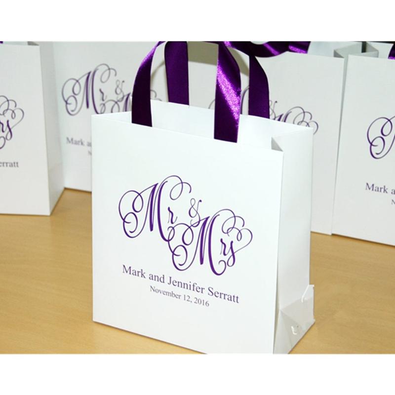 Personalized Wedding Gift Bags with Purple satin ribbon and Custom names welcome Bags Mr and Mrs wedding Gift bag for guests 
Personalized Wedding Gift Bags with Purple satin ribbon and Custom names welcome Bags Mr and Mrs wedding Gift bag for guests