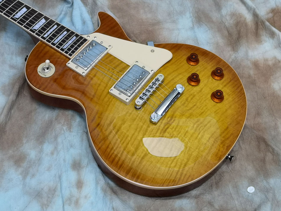 quality electric guitar one piece body, one piece neck, binding over frets Lemon Burst guitars
quality electric guitar one piece body, one piece neck, binding over frets Lemon Burst guitars