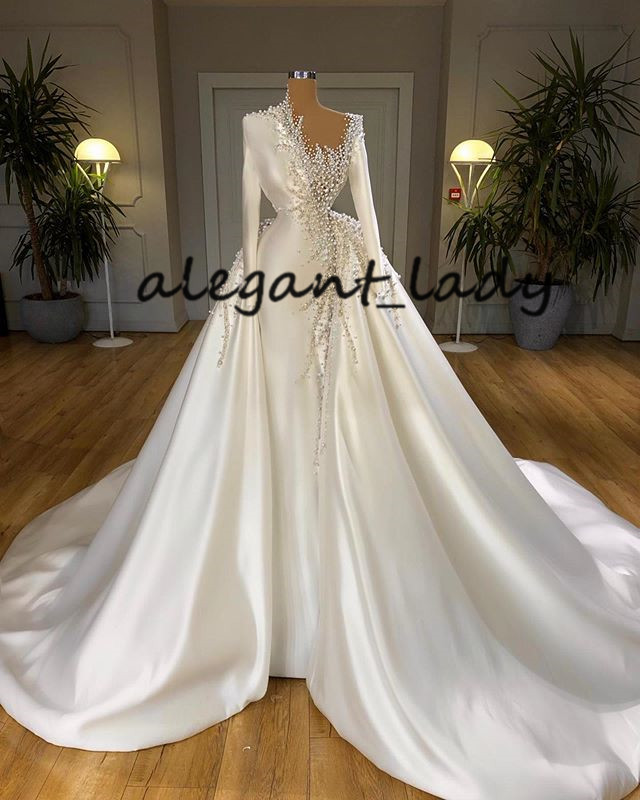 Plus Size Arabic Wedding Dresses 2021 Long Sleeve Luxury Pearls Beaded Puffy Overskirt Princess Church Garden Wedding Gowns valdrinsahiti