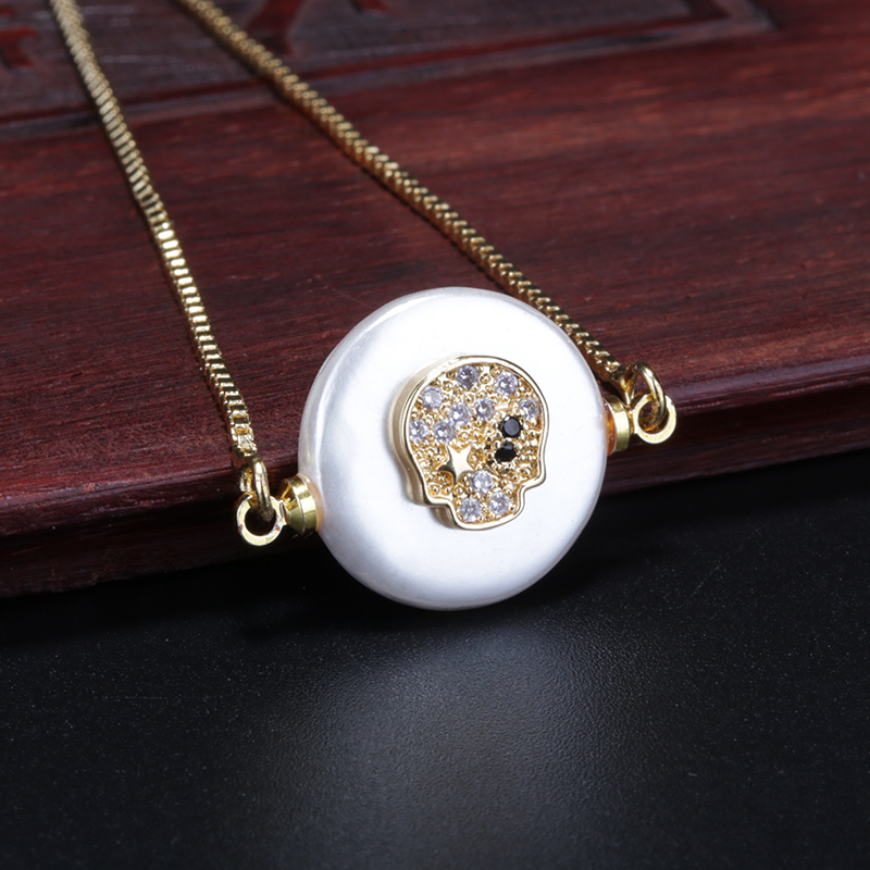 multiple colors cz micro paved gold skull charm on flat pearl shell connector beads thin link bracelets for woman
multiple colors cz micro paved gold skull charm on flat pearl shell connector beads thin link bracelets for woman