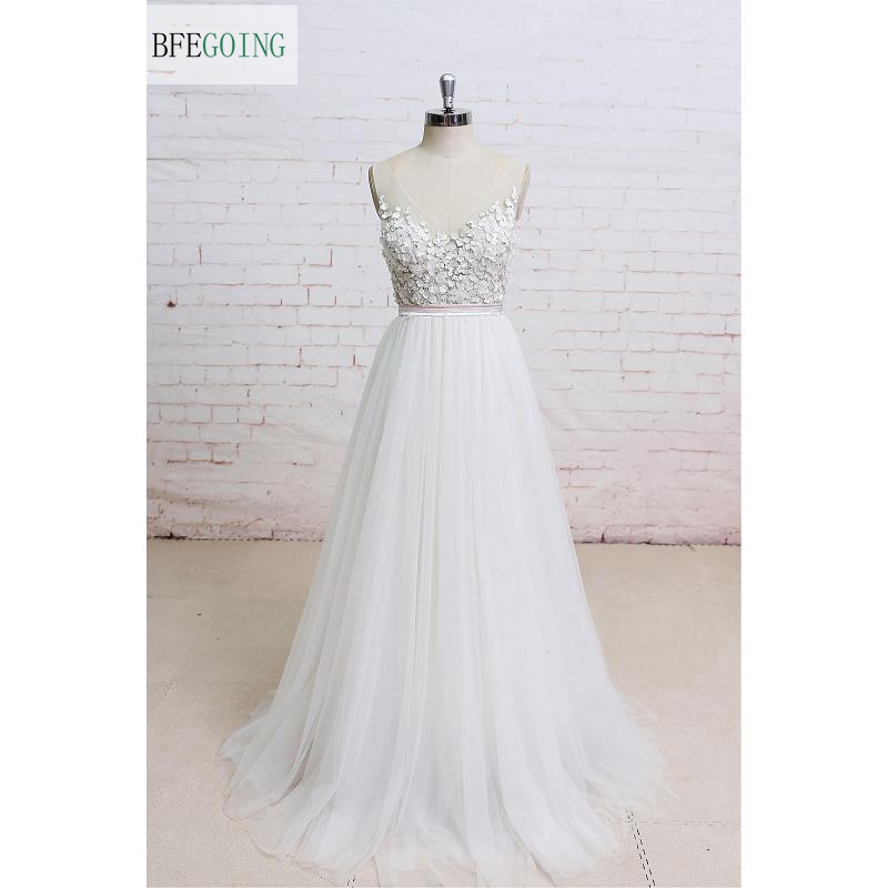 White V-Neck Appliques Tulle Floor-Length A-line Wedding dress Sleeveless Real/Original Photos Custom made
White V-Neck Appliques Tulle Floor-Length A-line Wedding dress Sleeveless Real/Original Photos Custom made