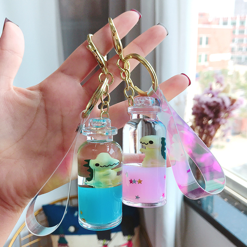 Floating Creative cute dinosaur acrylic milk bottle Keychain Moving Liquid quicksand drift bottle keyring for women bag pendant 
Floating Creative cute dinosaur acrylic milk bottle Keychain Moving Liquid quicksand drift bottle keyring for women bag pendant