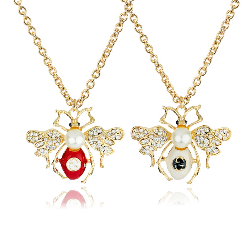 European and American new fashion simple creative alloy painting oil bee pendant necklace pearl rhinestone insect shape ornament
European and American new fashion simple creative alloy painting oil bee pendant necklace pearl rhinestone insect shape ornament