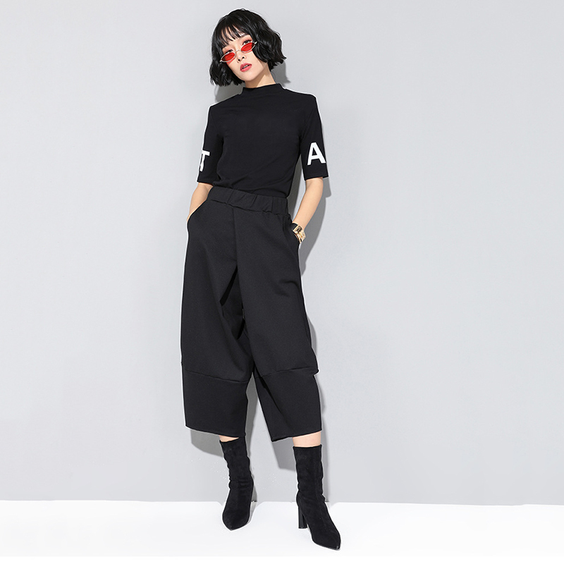 EAM Spring Autumn High Elastic Waist Black Loose Big Pocket Brief Loose Harem Pants Women Trousers Fashion JQ012 201228