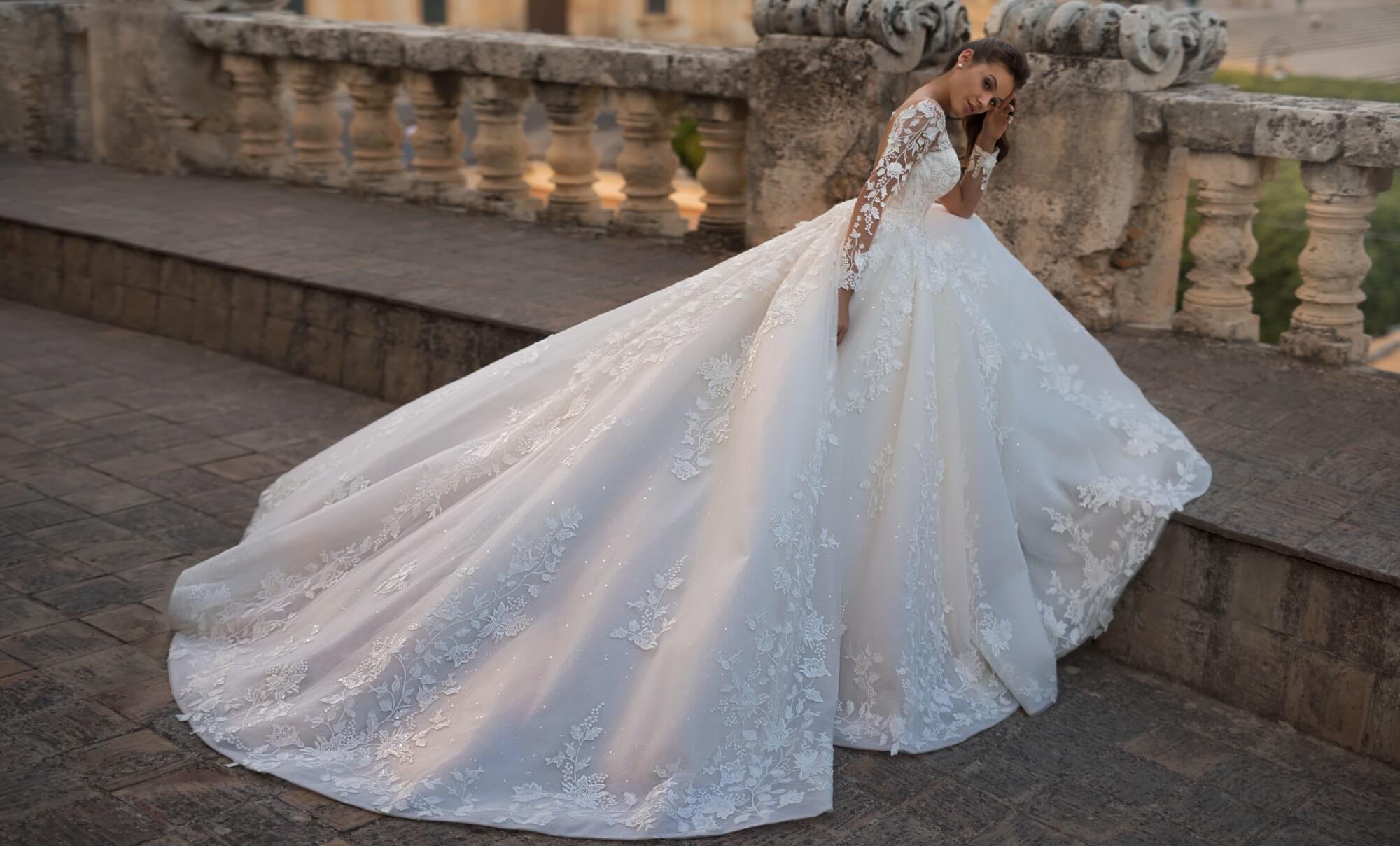 urious Turkey Lace Wedding Dresses Appliques Illusion Long Sleeves Puffy Skirt Sheer Jewel Neck Sexy Backless Lace-up Formal Bridal Gowns