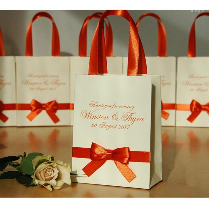 Personalized Elegant Ivory Wedding bag with Orange satin ribbon, bow and custom names Wedding welcome bags for guests Gifts1
Personalized Elegant Ivory Wedding bag with Orange satin ribbon, bow and custom names Wedding welcome bags for guests Gifts1