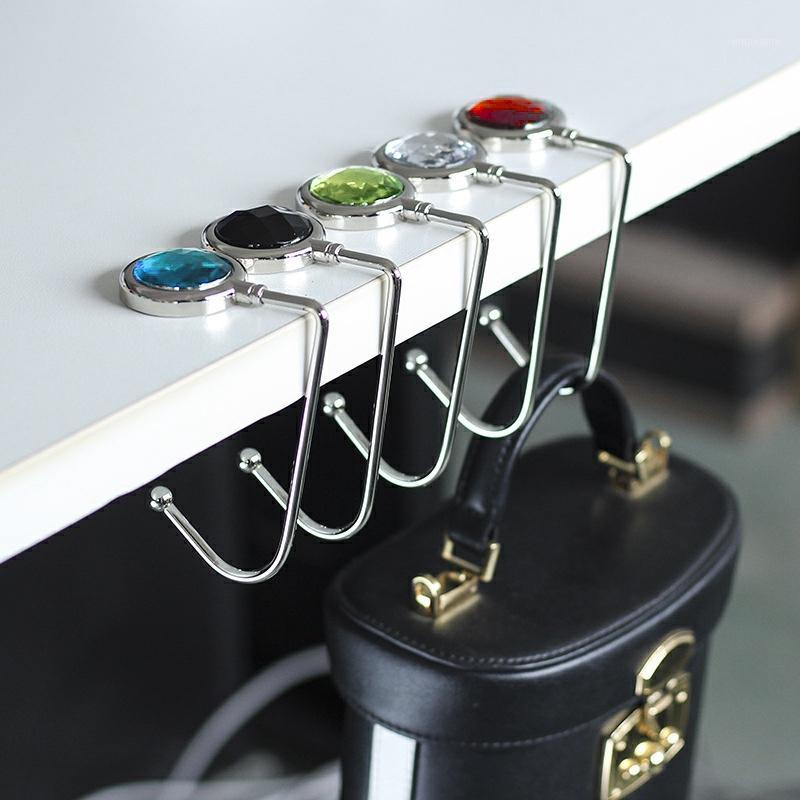 New Storage Hook Metal Bag Hook Hanger Creative Bag Purse Holder Shell Purse Handbag Portable Table Travel Home Storage1
New Storage Hook Metal Bag Hook Hanger Creative Bag Purse Holder Shell Purse Handbag Portable Table Travel Home Storage1