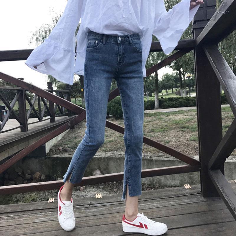 Summer new Korean fashion casual Slim scratching side slit hole jeans high waist female nine points pencil pants1
Summer new Korean fashion casual Slim scratching side slit hole jeans high waist female nine points pencil pants1