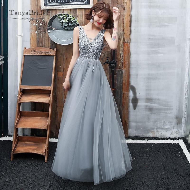 Prom Dresses 2020 Grey Silver V Neck A Line Crystal Sequin New Fashion Formal Evening Dress Gold vestidos de fiesta de noche
Prom Dresses 2020 Grey Silver V Neck A Line Crystal Sequin New Fashion Formal Evening Dress Gold vestidos de fiesta de noche