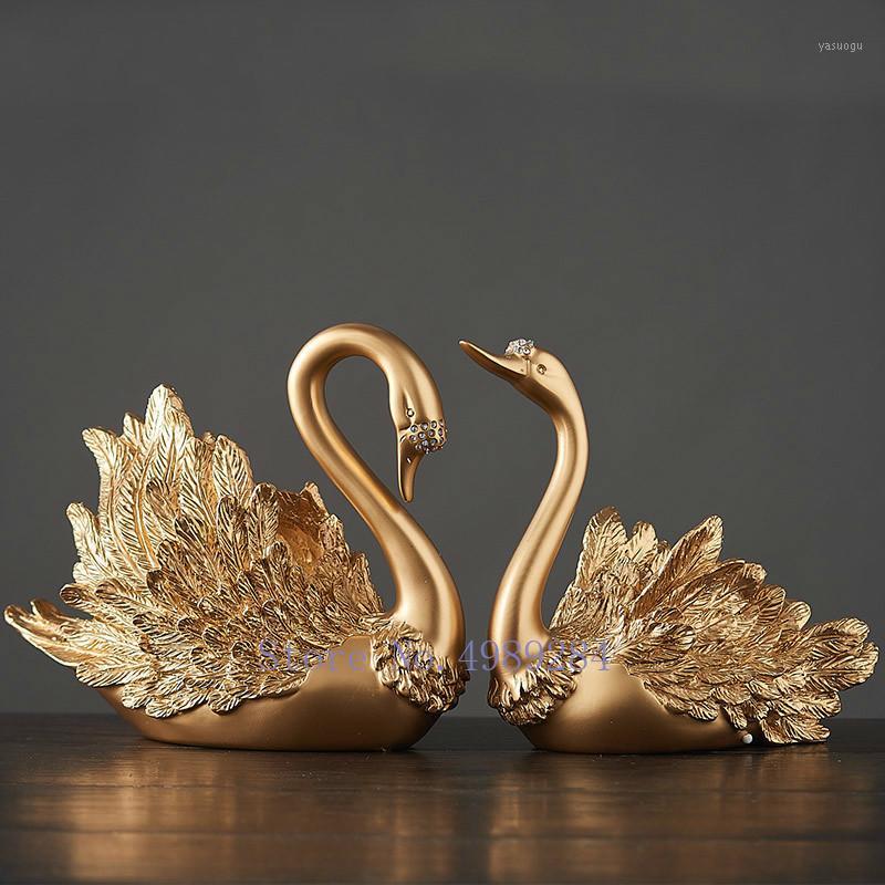 Nordic Creative Resin Gold swan Couple Crafts ornaments Modern home decoration accessories figurines christmas gift home decor1
Nordic Creative Resin Gold swan Couple Crafts ornaments Modern home decoration accessories figurines christmas gift home decor1