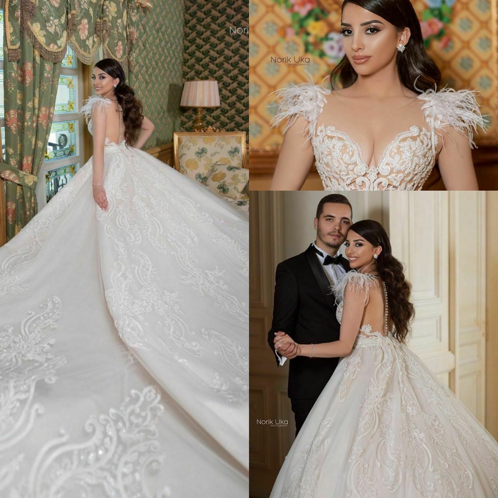 Feather Wedding Dresses Bridal Gowns Lace Country Appliqued Beads Sheer Jewel Neck cathedral train Wedding Dress Robe De Mariee